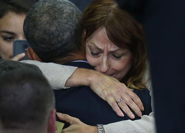 A woman becomes emotional as she hugs US President Barack Obama during an event at the University of Nebraska Omaha Baxter Arena. (AFP Photo) A woman becomes emotional as she hugs US President Barack Obama during an event at the University of Nebraska Omaha Baxter Arena. (AFP Photo)
