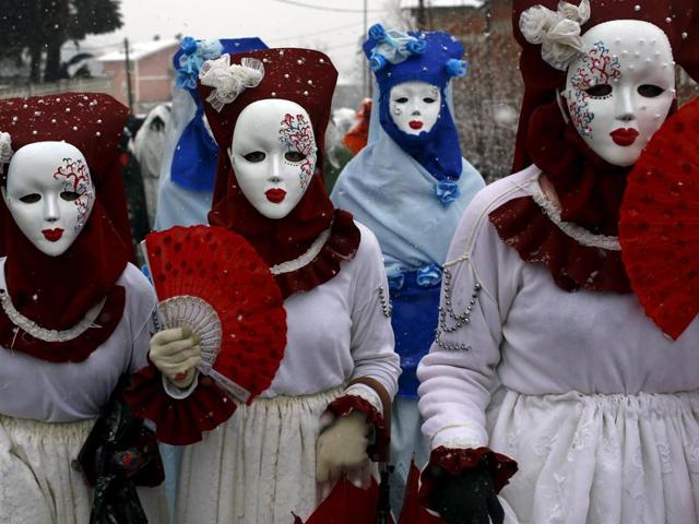 Revellers participate in a parade on the street during a carnival in Vevcani, Macedonia, January 13, 2016. Vevcani village marks the annual Orthodox St. Vasilij (Basil) Day with a carnival that features a 1,400-year-old celebration with pagan roots. (REUTERS)