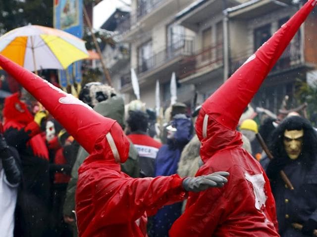 Revellers participate in a parade on the street during a carnival in Vevcani. (REUTERS)