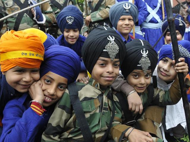 Tiny tots while performing the Gatka (martial art) during the Nagar Kirtan. (Gurminder Singh/HT Photo)