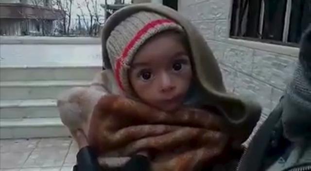 A toddler is held up to the camera in this still image taken from video said to be shot in Madaya on January 5, 2016. (REUTERS) A toddler is held up to the camera in this still image taken from video said to be shot in Madaya on January 5, 2016. (REUTERS)