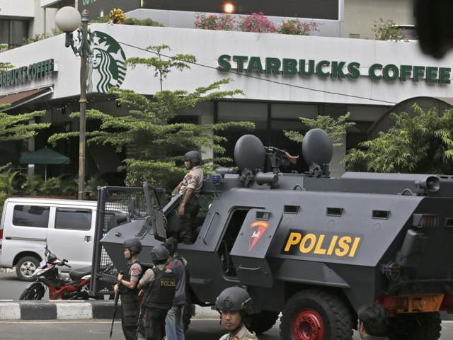 A police armoured vehicle is parked outside a Starbucks Cafe near where an explosion went off in Jakarta, Indonesia. (AP) A police armoured vehicle is parked outside a Starbucks Cafe near where an explosion went off in Jakarta, Indonesia. (AP)