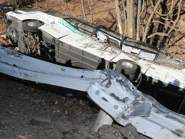 The wreckage of a bus which crashed after running off a road in Karuizawa, Nagano Prefecture, on January 15, 2016. Fourteen people were killed and dozens injured when a bus taking them to a ski resort ran off a mountain road in central Japan. (AFP) The wreckage of a bus which crashed after running off a road in Karuizawa, Nagano Prefecture, on January 15, 2016. Fourteen people were killed and dozens injured when a bus taking them to a ski resort ran off a mountain road in central Japan. (AFP)