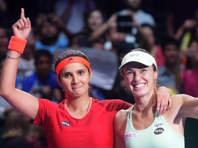 Sania Mirza of India (L) and Switzerland's Martina Hingis’ win is their 30th in a row.(AFP Photo)