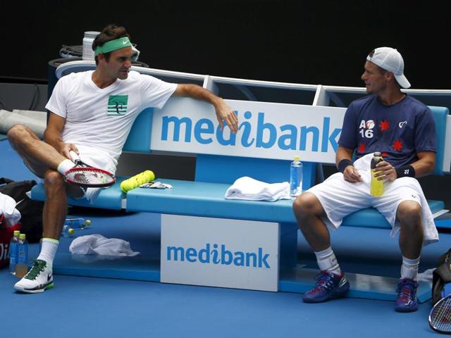 Federer talks to Australia's Lleyton Hewitt as they take a break during a practice session. (Reuters Photo) Federer talks to Australia's Lleyton Hewitt as they take a break during a practice session. (Reuters Photo)