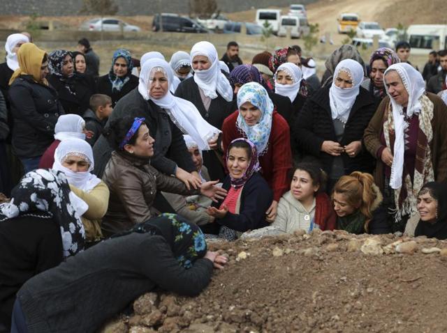 Women cry at the funeral of Lokman Acikgoz and his two sons in Cinar. The members of the family were among several people killed late Wednesday when Kurdish militants detonated a car bomb at a police station in Cinar. (AP) Women cry at the funeral of Lokman Acikgoz and his two sons in Cinar. The members of the family were among several people killed late Wednesday when Kurdish militants detonated a car bomb at a police station in Cinar. (AP)
