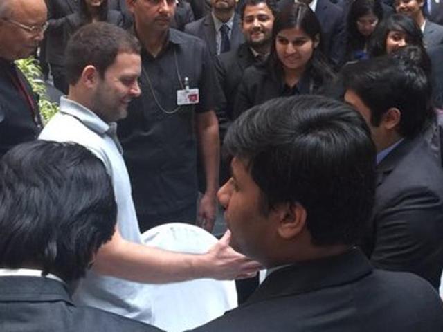 Gandhi shakes hands with a student at NMIMS after his speech and a Q and A session. (Twitter)
