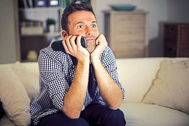 Glued to the idiot box: With TV screens getting bigger and international shows releasing at the same time as abroad, staying at home and channel surfing will be the norm. (Photo: Shutterstock)
