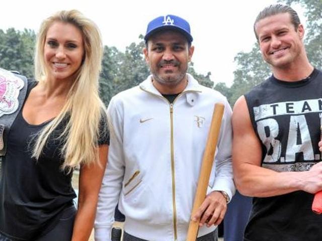 WWE superstars Dolph Ziggler and Charlotte played cricket with former Indian cricketer Virender Sehwag. (Photo: WWE.com) WWE superstars Dolph Ziggler and Charlotte played cricket with former Indian cricketer Virender Sehwag. (Photo: WWE.com)