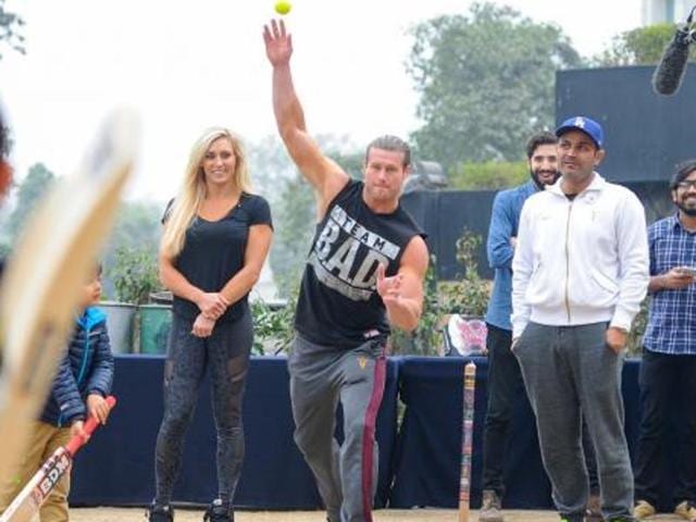 WWE superstars Dolph Ziggler and Charlotte tried their hand in cricker with VirenderSehwag. (Photo: WWE.com) WWE superstars Dolph Ziggler and Charlotte tried their hand in cricker with VirenderSehwag. (Photo: WWE.com)