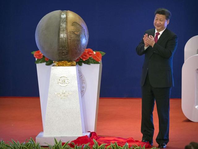 Chinese President Xi Jinping applauds after unveiling a sculpture during the opening ceremony of the Asian Infrastructure Investment Bank (AIIB) in Beijing Saturday. (AFP) Chinese President Xi Jinping applauds after unveiling a sculpture during the opening ceremony of the Asian Infrastructure Investment Bank (AIIB) in Beijing Saturday. (AFP)