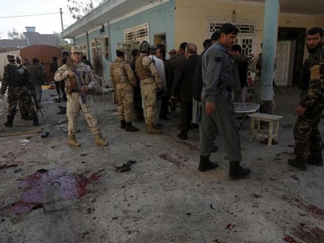 Afghan security forces inspect the site of a suicide attack in Jalalabad, Afghanistan. (Reuters Photo)