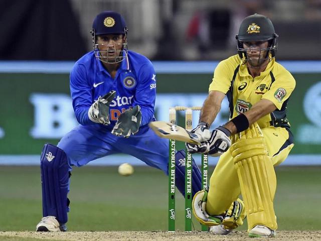 Australia's Glenn Maxwell hits a reverse sweep watched by India's MS Dhoni. (AP)