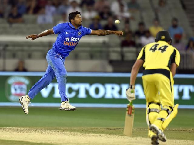 India's Umesh Yadav fields after bowling to Australia's James Faulkner during their one day international cricket match in Melbourne. (AP)