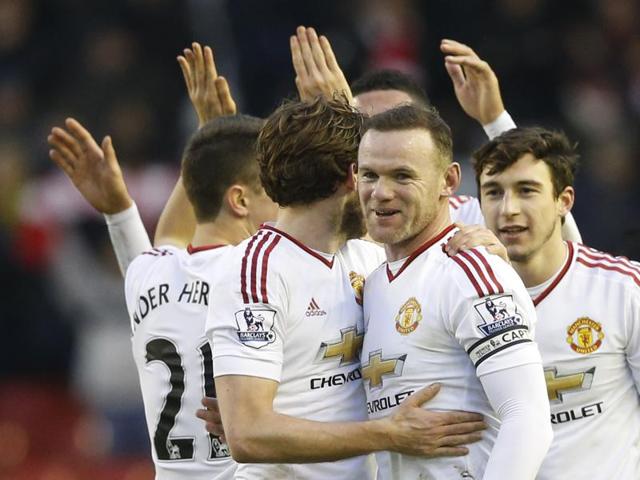Wayne Rooney celebrates at full time with teammates. (REUTERS) Wayne Rooney celebrates at full time with teammates. (REUTERS)