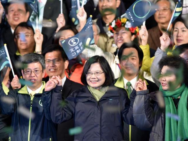 Taiwan's President-elect Tsai Ing-wen (C), from the Democratic Progressive Party (DPP), joins hands with counterpart Chen Chien-jen (L) after winning the elections in Taipei on January 15, 2016. (AFP) Taiwan's President-elect Tsai Ing-wen (C), from the Democratic Progressive Party (DPP), joins hands with counterpart Chen Chien-jen (L) after winning the elections in Taipei on January 15, 2016. (AFP)