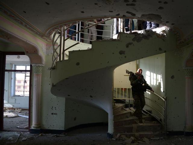 An Afghan security force personnel walks inside a building used by insurgents to launch an attack on the Indian consulate in Mazar-i-Sharif. (AFP) An Afghan security force personnel walks inside a building used by insurgents to launch an attack on the Indian consulate in Mazar-i-Sharif. (AFP)