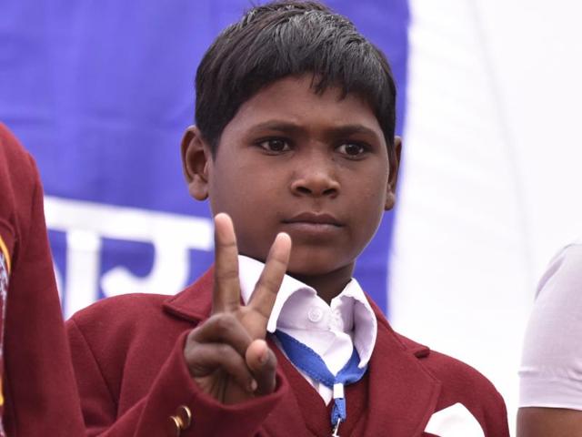 On August 30, 2014, nine-year-old Nilesh Revaram Bhil had gone to the Muktai temple in Jalgaon district of Maharashtra with his maternal uncle when he heard someone scream and a saw a boy drowning in the river. Showing spontaneous act of courage Nilesh jumped into the 10-feet deep water to save the boy (Virendra Singh Gosain/ Hindustan Times) 