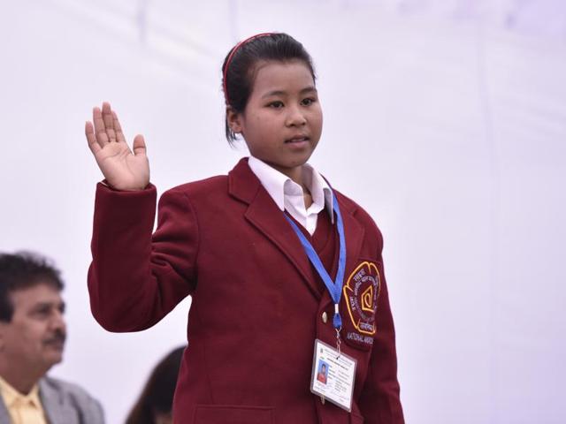 Meghalaya’s Angelica Tynsong, who is 13 years and 2 months old, saved her sibling who was trapped inside their burning house. Angelica spotted her house on fire while washing clothes on January 31, 2015. She immediately ran inside to rescue her sibling. Her entire house was gutted in the devastating fire. (Virendra Singh Gosain/ Hindustan Times) 