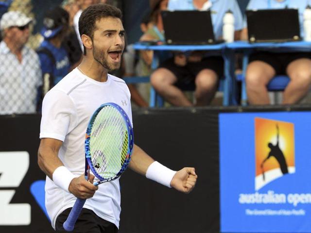 Noah Rubin of the US celebrates after defeating France's Benoit Paire in the first round. (Reuters Photo)