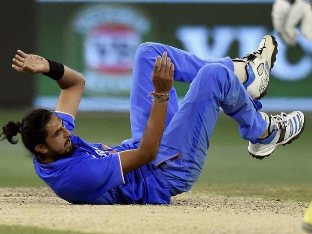 India's Ishant Sharma falls to the ground after bowling to Australia's James Faulkner during their one day international cricket match in Melbourne on January 17, 2016.(AP Photo)