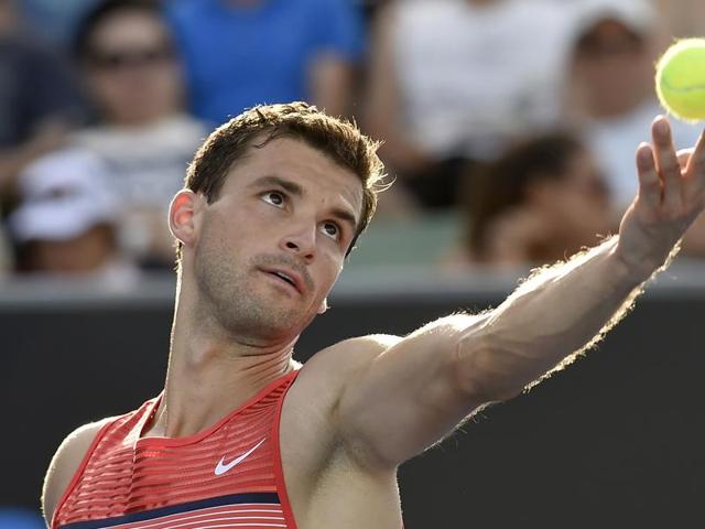 Grigor Dimitrov of Bulgaria serves to Paolo Lorenzi of Italy during their first round match. (AP Photo)