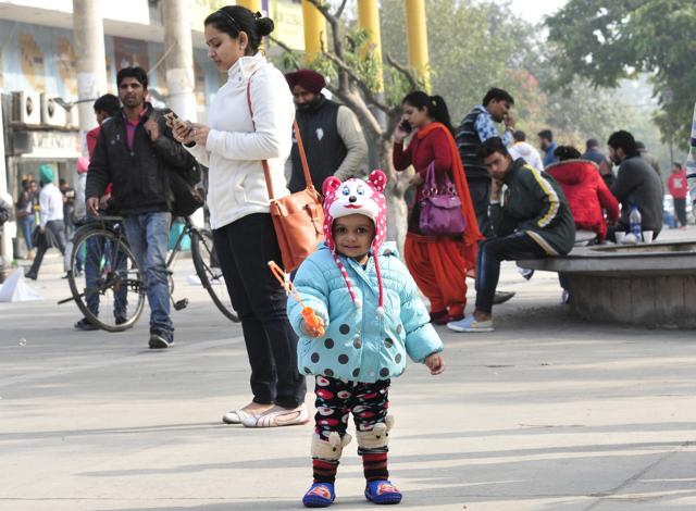 Meanwhile, a child enjoys as the sun finally shines later during the day in Chandigarh. (Keshav SIngh/HT Photo)
