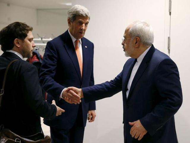 US Secretary of State John Kerry talks with Iranian Foreign Minister Mohammad Javad Zarif after the International Atomic Energy Agency (IAEA) verified that Iran has met all conditions under the nuclear deal, in Vienna January 16, 2016. (REUTERS) US Secretary of State John Kerry talks with Iranian Foreign Minister Mohammad Javad Zarif after the International Atomic Energy Agency (IAEA) verified that Iran has met all conditions under the nuclear deal, in Vienna January 16, 2016. (REUTERS)
