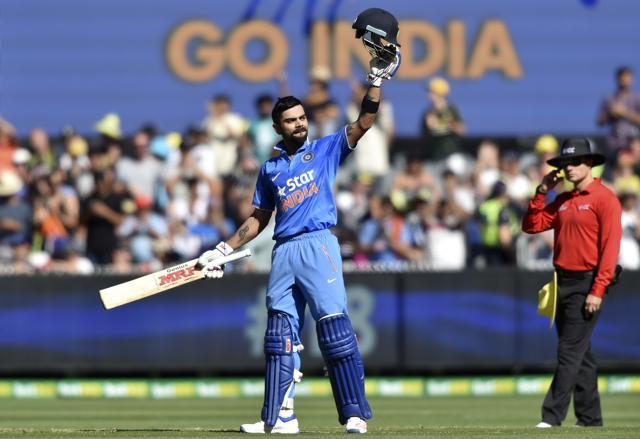 Virat Kohli and Ajinkya Rahane celebrate the wicket of Shaun Marsh