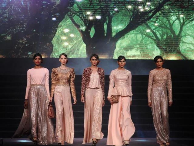 Models showcase creations by designer Vikram Phadnis during the fashion gala. (AFP) Models showcase creations by designer Vikram Phadnis during the fashion gala. (AFP)