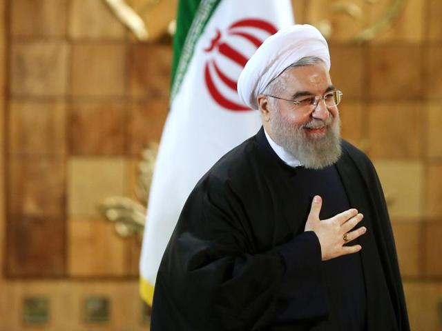 Iran's President Hassan Rouhani gestures at a press conference in Tehran. The implementation of a historic nuclear deal with world powers is expected to pave the way for a new economic reality in Iran, now freed from harsh international sanctions.(AP)