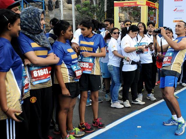 Bollywood actor Rahul Bose takes a photograph at the 2016 Mumbai Marathon in Mumbai on January 17, 2016.  (AFP) 