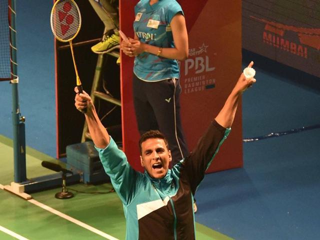 Bollywood actor Akshay Kumar celebrates after a friendly match during the Premier Badminton League's Mix doubles match in New Delhi on Sunday.  (PTI) 