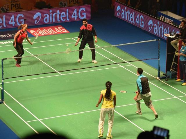 While Akshay and Abhishek played a friendly match during the Premier Badminton League in New Delhi, Katrina decided to participate in Mumbai marathon. Take a look. (PTI) 