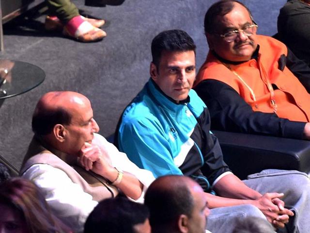Home Minister Rajnath Singh and Bollywood actor Akshay Kumar during the Premier Badminton League in New Delhi on Sunday.  (PTI) 