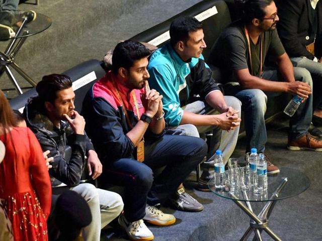 Bollywood actors Abhishek Bachchan, Akshay Kumar and Ritesh Deshmukh during the Premier Badminton League in New Delhi on Sunday.  (PTI) 