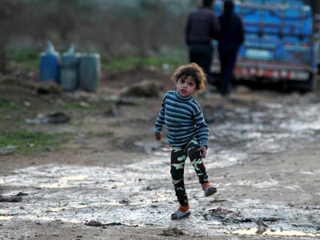 An internally displaced girl stands inside a refugee camp in Salkeen, Northern Idlib countryside, Syria. (REUTERS) An internally displaced girl stands inside a refugee camp in Salkeen, Northern Idlib countryside, Syria. (REUTERS)