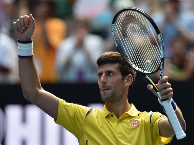 Serbia's Novak Djokovic celebrates after victory in his men's singles match against South Korea's Chung Hyeon on day one of the 2016 Australian Open in Melbourne on January 18, 2016. (AFP Photo)