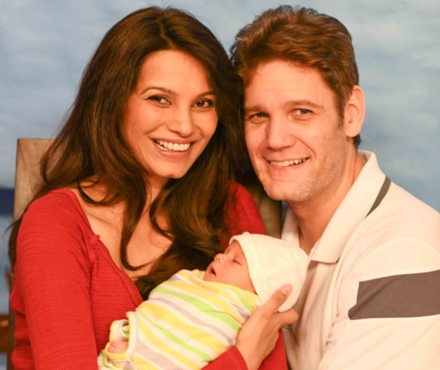 Diana Hayden with husband Collin and baby Arya in their first photograph together as a family.