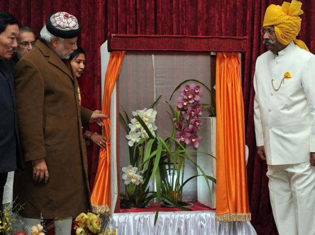 Prime Minister Modi posing with the Cymbidium named in his honour.(Photo courtesy: PMO’s official Twitter handle) Prime Minister Modi posing with the Cymbidium named in his honour.(Photo courtesy: PMO’s official Twitter handle)