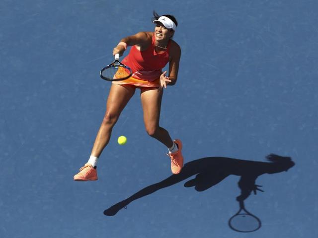 Spain's Garbine Muguruza jumps to hit a shot during her first round match against Estonia's Anett Kontaveit. (Jason O'Brien/ REUTERS) 