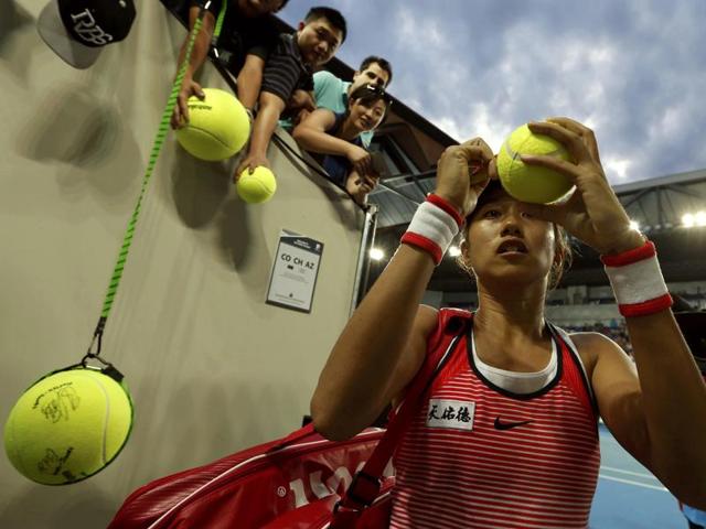 China's Zhang Shuai signs autographs after winning her first round match against Romania's Simona Halep. (Jason Reed/ REUTERS) 