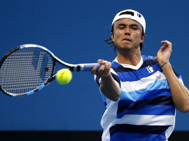 Taro Daniel of Japan makes a forehand return to Lukas Rosol of the Czech Republic during their first round match. (Vincent Thian/ AP Photo) 