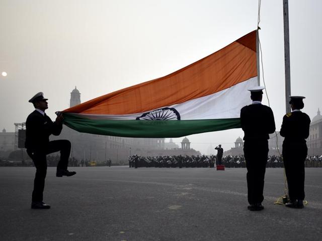 Indian Navy personnel hoist the flag during the Beating Retreat parade rehearsal, in New Delhi. (Ravi Choudhary/ HT Photo) Indian Navy personnel hoist the flag during the Beating Retreat parade rehearsal, in New Delhi. (Ravi Choudhary/ HT Photo)