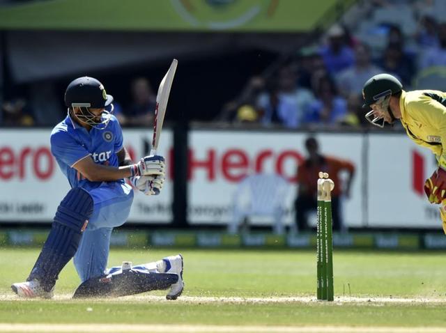 Australia's batsman Glenn Maxwell plays a shot as India's wicketkeeper MS Dhoni looks on during the third one-day international cricket match. (AFP Photo) Australia's batsman Glenn Maxwell plays a shot as India's wicketkeeper MS Dhoni looks on during the third one-day international cricket match. (AFP Photo)