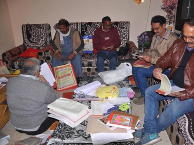Lokayukta sleuths examining documents at the house of cooperative manager Basantilal Sharma in Ujjain on Tuesday. Lokayukta sleuths examining documents at the house of cooperative manager Basantilal Sharma in Ujjain on Tuesday.