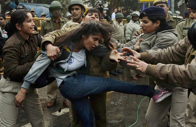 Police detain a girl student during a protest against the ministry of human resource development in New Delhi. (PTI) Police detain a girl student during a protest against the ministry of human resource development in New Delhi. (PTI)