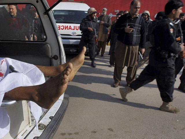 Charsadda : An ambulance transports the body of a victim while Pakistani troops gather at the main gate of Bacha Khan University in Charsadda town. (AP Photo) Charsadda : An ambulance transports the body of a victim while Pakistani troops gather at the main gate of Bacha Khan University in Charsadda town. (AP Photo)