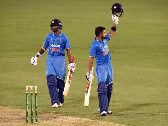 Virat Kohli (R) celebrates his century with partner Shikhar Dhawan. (AFP Photo) 