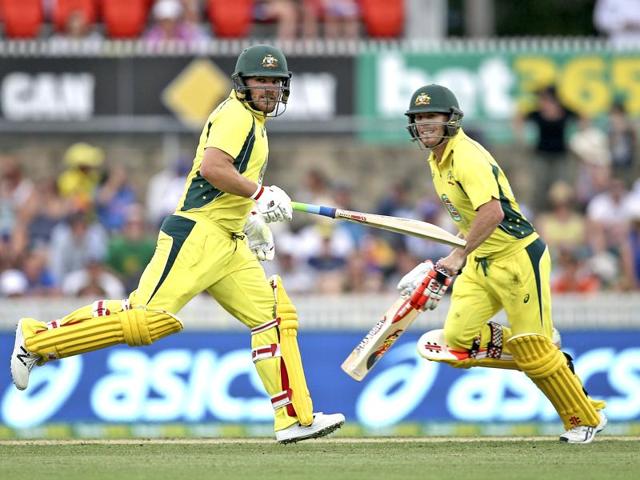 Australian batsman David Warner, right, and Aaron Finch run between the wickets. (AP Photo) 